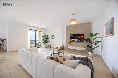a living room with a white couch and a table at 1 Br Boho Beach Ain Full Sea View JBR 1 min in Dubai