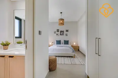 a bedroom with a bed and a bathroom at 3 BR W Maid Walk to Pool, Arabian Ranches III Ruba in Dubai