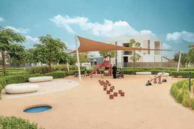 a park with a playground with a canopy and slides at 3 BR W Maid Walk to Pool, Arabian Ranches III Ruba in Dubai