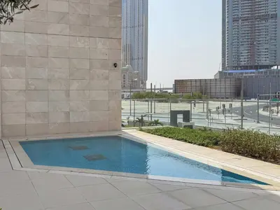a swimming pool on the side of a building at Frank Porter - Canal Front Residence 9A in Dubai