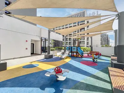 a play area with a playground on a building at Elegant & Cozy Home with Stylish Modern Interiors in Dubai
