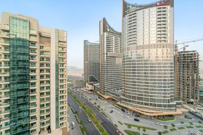 an aerial view of a city with tall buildings at FIRST CLASS 1BR Canal Views , Gem of Mayfair in Dubai