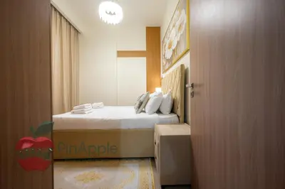a bedroom with a bed with a box at Beautiful1BR Close to Downtown in Dubai