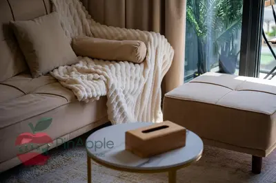 a living room with a couch and a box on a table at Beautiful1BR Close to Downtown in Dubai