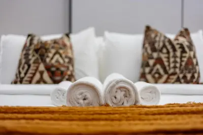 a pile of rolled up towels on a table at ShoresInn -Waterfront Bliss in Dubai Marina in Dubai