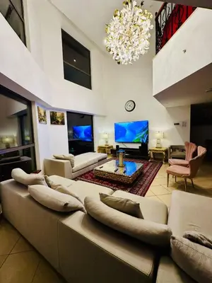 a large living room with a large couch and a tv at Private Room Steps from Jumeriah Beach & Marina Walk - LMY Sadaf 7 JBR Dubai in Dubai