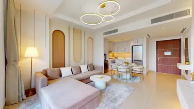 a living room with a couch and a table at Vacationer I Luxury 2 Bedroom I Burj Khalifa View in Dubai