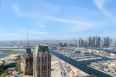 an aerial view of a city with a river and buildings at Marina 2BR with 31st-Floor Ocean View in Dubai