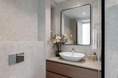 a bathroom with a sink and a mirror at Maison Privee - Dazzling Downtown Retreat with Panoramic City Views in Dubai