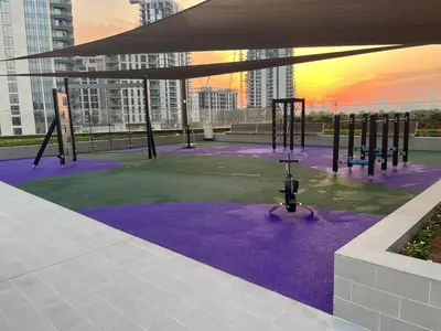 a playground on a roof with purple carpet at Luxury Stay - Dubai Creek Harbour - Branded Living - Burj View in Dubai
