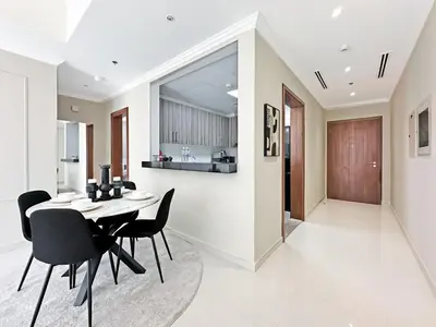 a kitchen and dining room with a table and chairs at Luxury Stay in Downtown Dubai -Burj Khalifa in Dubai