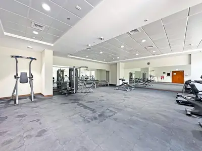 a large gym with treadmills and cardio machines at Luxury Stay in Downtown Dubai -Burj Khalifa in Dubai