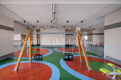 a gym with a green and red floor and swings at Studio for 4 just 5 Min Walk to Burj Khalifa, Downtown Dubai, Tower Elite 1 in Dubai