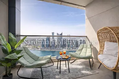 a balcony with two chairs and a table with drinks on it at Studio for 4 just 5 Min Walk to Burj Khalifa, Downtown Dubai, Tower Elite 1 in Dubai