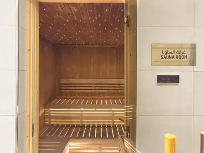 a hallway with benches in a subway room at Stylish 1BR w/ Pool View | Heart of Business Bay in Dubai