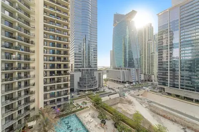 an aerial view of a city with tall buildings at Stylish 1BR w/ Pool View | Heart of Business Bay in Dubai