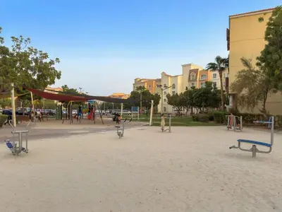 an empty playground in a park with swings at FIRST CLASS 1BR Stylish Escape , Near Metro in Dubai