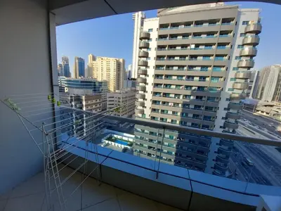 a view of a city skyline from a window at Dubai Marina Apartment in Dubai
