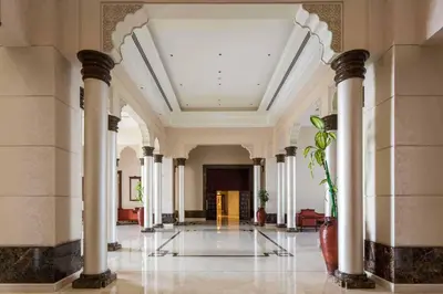 an empty hallway with columns in a building at Elegant 2BR Beach Apartment Grandeur Residence, Palm Jumeirah in Dubai