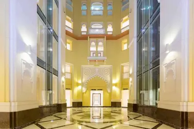 a hallway of a building with a door at Elegant 2BR Beach Apartment Grandeur Residence, Palm Jumeirah in Dubai