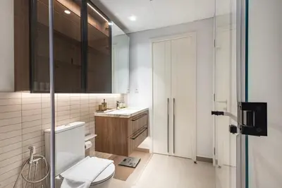 a bathroom with a toilet and a sink at Hamilton House, JVC - 1 Bedroom Apartment - Allsopp & Allsopp in Dubai