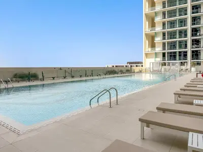 a swimming pool in the middle of a building at FIRST CLASS 1BR Luxurious JVC Blissful Escape in Dubai