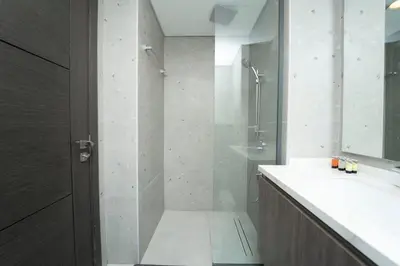 a bathroom with a shower and a sink at AWS Holiday Homes - Modernity with a View in Dubai