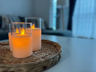 two candles sitting on top of a table at COZY 1BD in Dubai Marina in Dubai