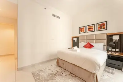 a bedroom with a large bed in a room at Elegant Business Bay 2 Bedroom with Sauna, Pool and Jacuzzi in Dubai