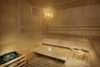 a wooden sauna with a bench in the middle at Elegant Business Bay 2 Bedroom with Sauna, Pool and Jacuzzi in Dubai