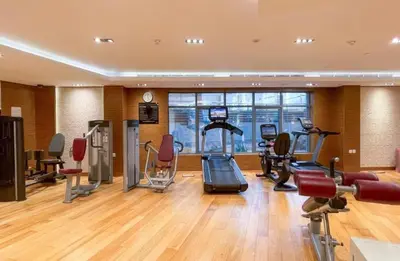 a gym with treadmills and cardio equipment in a building at Elegant Business Bay 2 Bedroom with Sauna, Pool and Jacuzzi in Dubai