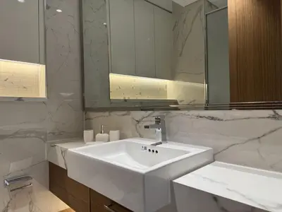 a bathroom with a white sink and a mirror at DiSalvo Luxury Studio in Azizi riviera 67 in Dubai