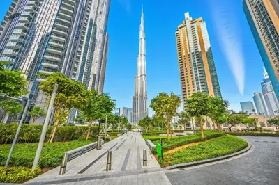 a street in the city with skyscrapers at 28th Floor Apartment Next to Burj And Mall Sleeps 7 in Dubai