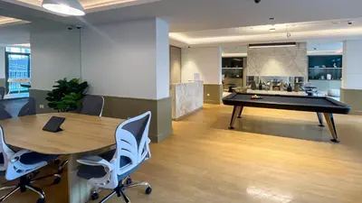 an office with a ping pong table and a pool table at Belgravia Square, JVC - 1 Bedroom Apartment - Allsopp & Allsopp in Dubai