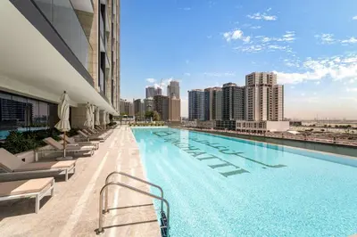 a swimming pool on the roof of a building at Trillionaire Studio, Canal Views, Private Jacuzzi in Dubai