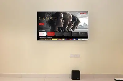 a poster on the wall of a room at Amazing Views of Palm & Dubai Eye Stylish Studio in Dubai