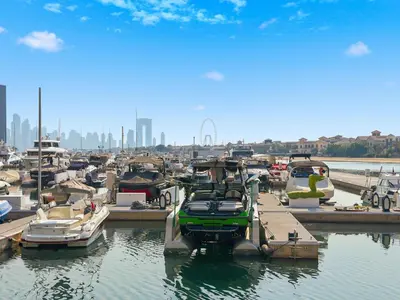 a group of boats parked in a marina at Amazing Views of Palm & Dubai Eye Stylish Studio in Dubai