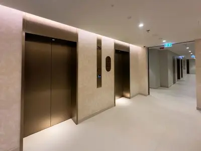a row of elevator doors in a building at Palace Beachfront Dubai Harbour in Dubai