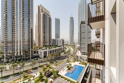 a view of a city from a building with a pool at Creek crescent in Dubai