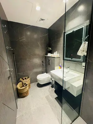 a bathroom with a sink and a toilet at Modern Studio Retreat in Al Barsha South Dubai in Dubai