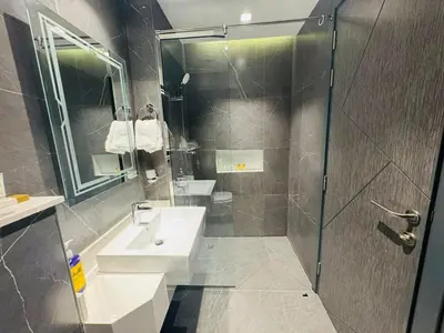 a bathroom with a sink and a shower at Modern Studio Retreat in Al Barsha South Dubai in Dubai