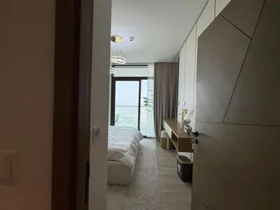 a hotel room with a bed and a desk at Luxury two beds apartment in Dubai