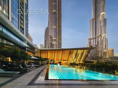 a swimming pool in a city with tall buildings at Grande Tower by Emaar, Downtown, Burj Khalifa in Dubai
