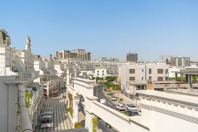 a view of a city with buildings and cars at Classy Studio APT Close To Dubai Miracle Garden in Dubai