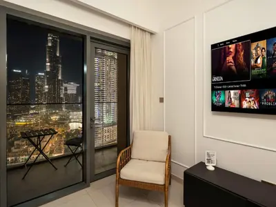 a room with a window with a view of a city at ABI Holiday Homes - Burj Khalifa and Fountain view Downtown in Dubai