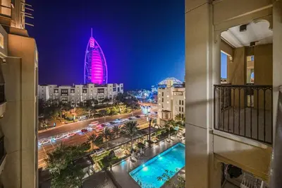 a view of a city at night with a tall building at Lamtara in Dubai