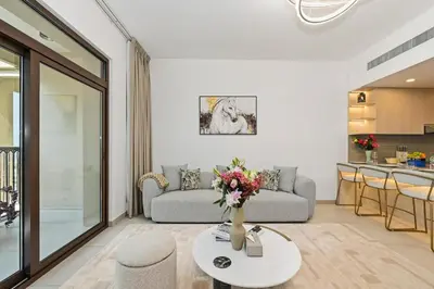 a living room with a couch and a table at Lamtara in Dubai