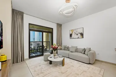 a living room with a couch and a table at Lamtara in Dubai