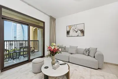 a living room with a couch and a table at Lamtara in Dubai