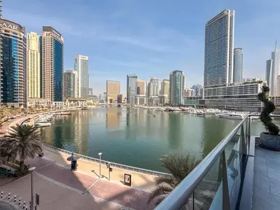 a view of a river in a city with tall buildings at GuestReady - Cozy Studio | Pool & Gym | Canal view in Dubai